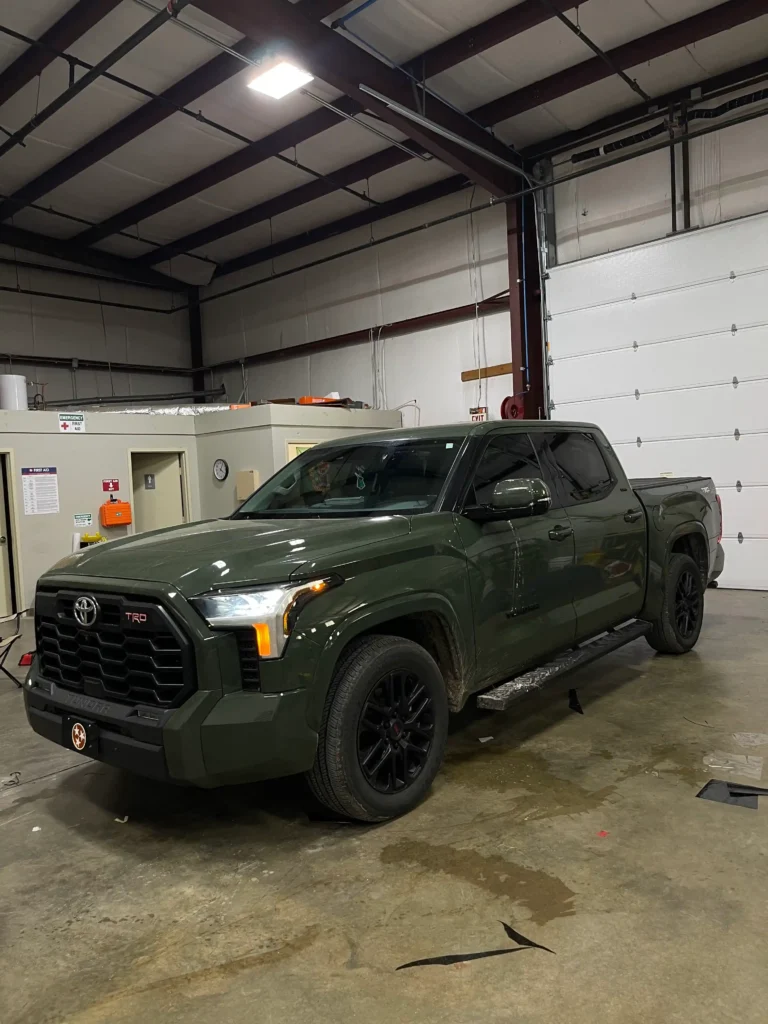 Applying ceramic window tint to a car in Nashville by Shade Shoppe