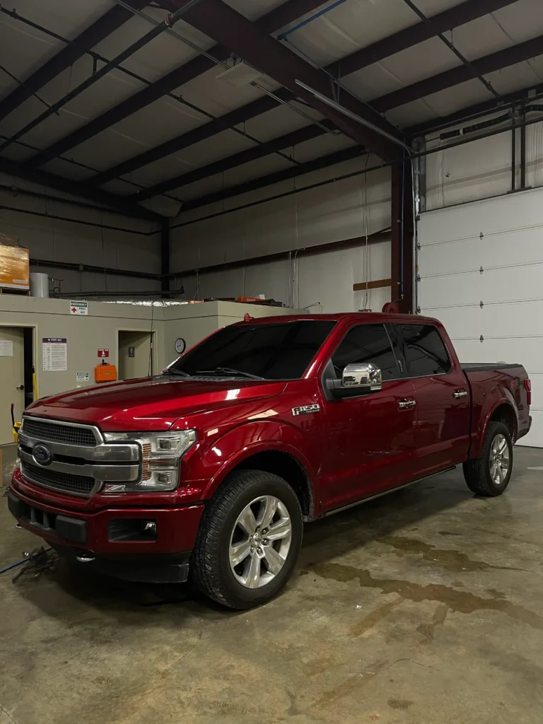 Applying ceramic window tint to a car in Nashville by Shade Shoppe